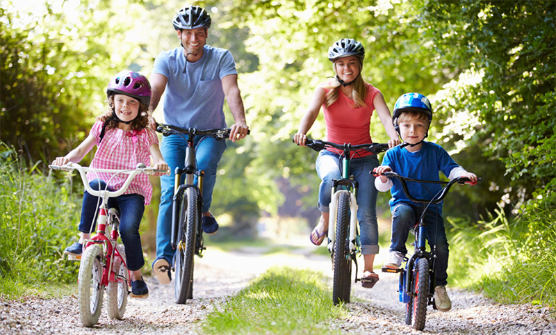 Family On Cycle Ride In Countryside